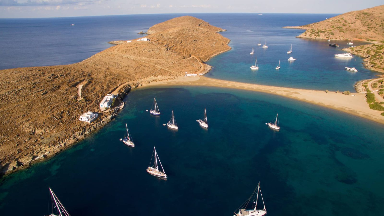 Sailing yachts anchored off Kolona beach, Kythnos, in the Cyclades
