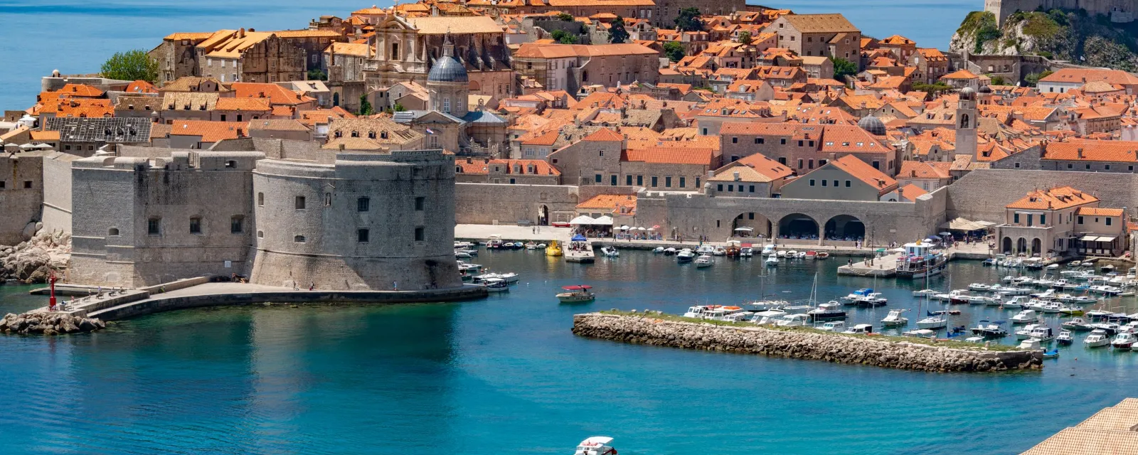 Dubrovnik old town walls and old harbour seen from the sea