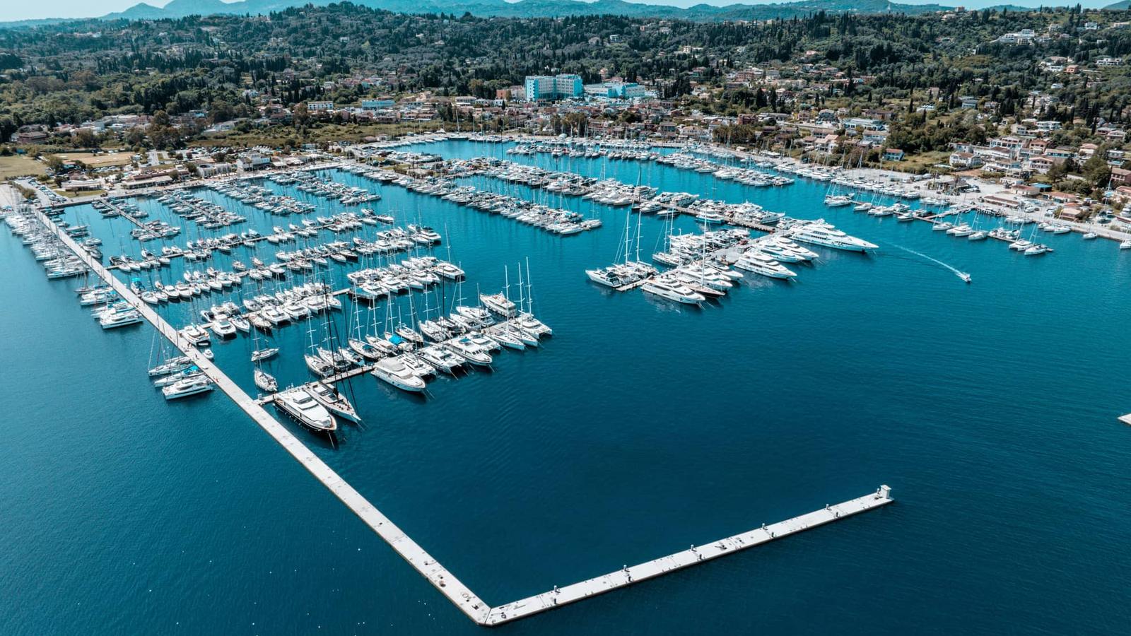 Aerial view of charter yachts and sailboats moored in a marina in Corfu, Greece